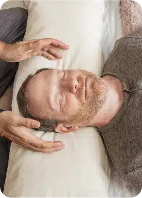 A client resting deeply during a reiki session at Word of Mouth